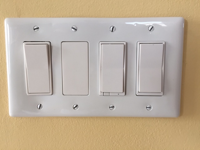 4 Gang wallplate fully loaded with switches and the Decora blank